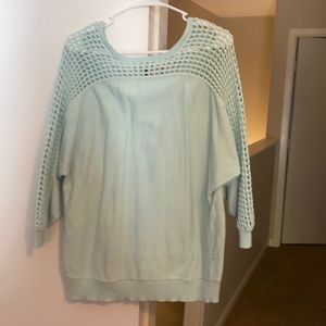 Light teal long sleeve top with knit detail on arms and back